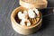 è‚‰ã¾ã‚“. steamed pork bun. Chinese Traditional cuisine concept. Dumplings Dim Sum in bamboo steamer with text copy space. Asian